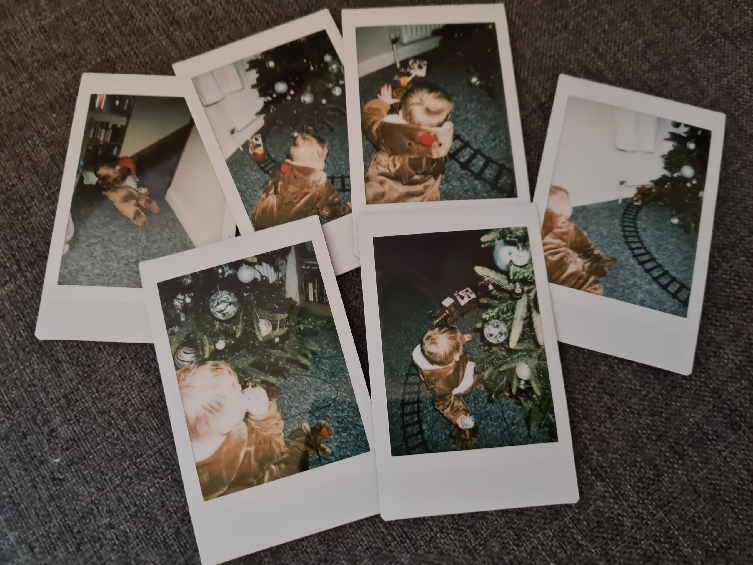 Polaroid pictures of christmas tree and baby