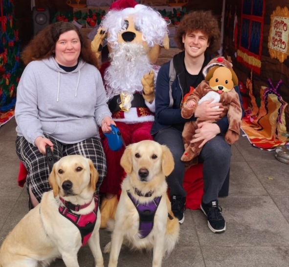 family photo with dogs and santa